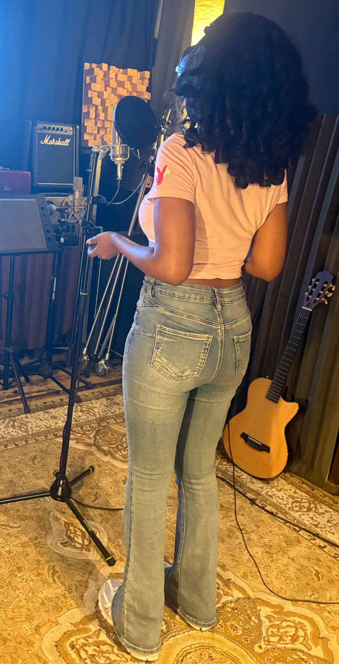 voice of Elou delivering professional voiceover services in recording studio